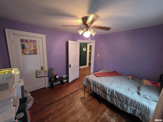 bedroom with ceiling fan and wood finished floors