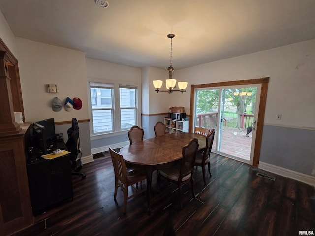 dining area with an inviting chandelier, baseboards, dark wood finished floors, and visible vents