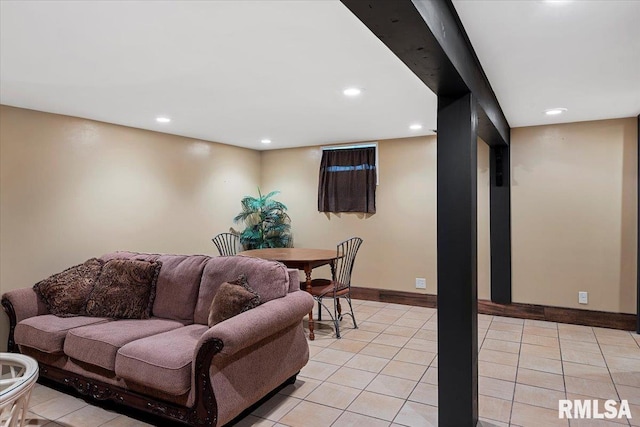 living room with recessed lighting, baseboards, and light tile patterned flooring