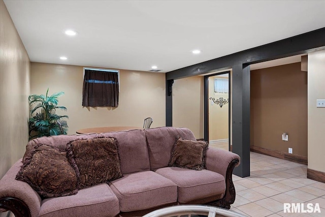 living room featuring recessed lighting, baseboards, and light tile patterned floors