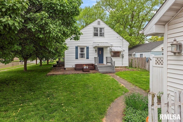 bungalow-style home featuring fence and a front yard