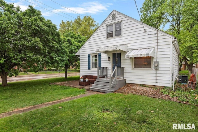 bungalow-style house featuring central AC and a front lawn
