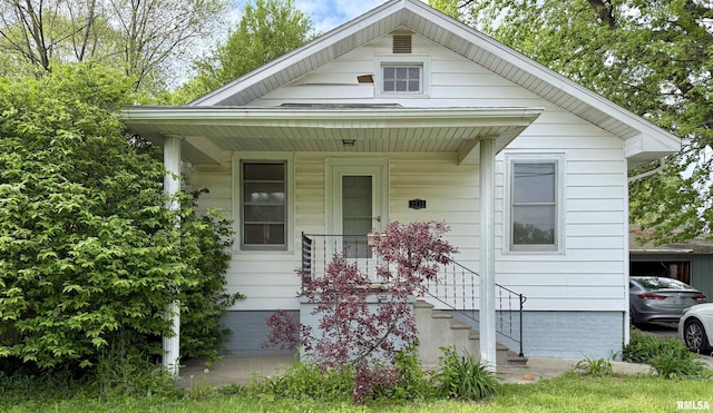 view of front of home with a porch and crawl space