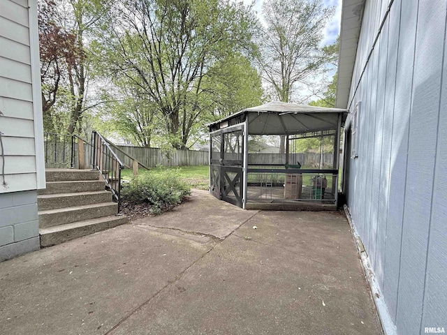 view of patio with a gazebo and a fenced backyard