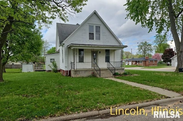 view of front of house featuring covered porch and a front lawn