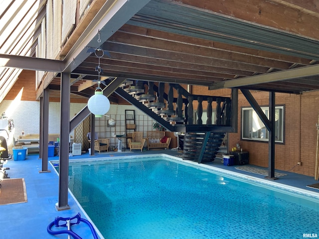 indoor pool featuring a patio area