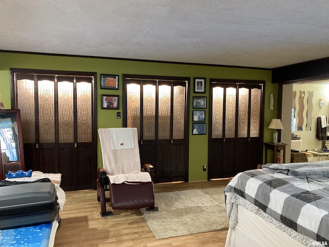 bedroom featuring light wood-style floors