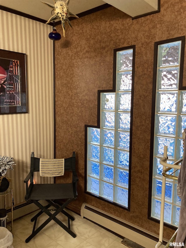 sitting room featuring a baseboard heating unit and tile patterned floors