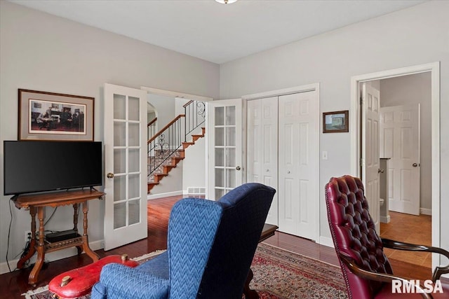 office area with wood finished floors, visible vents, french doors, and baseboards