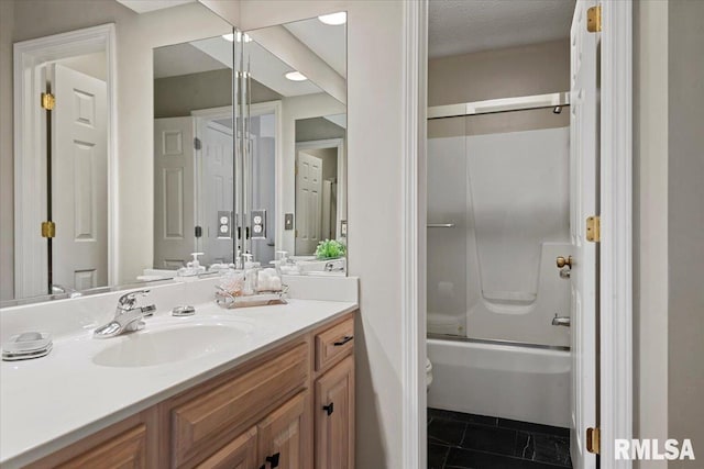full bathroom featuring vanity, toilet, combined bath / shower with glass door, and tile patterned flooring