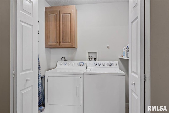 laundry area with washer and clothes dryer and cabinet space
