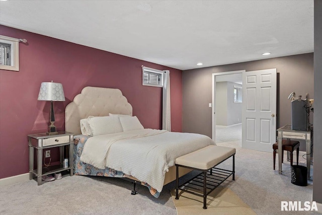 carpeted bedroom featuring baseboards and recessed lighting