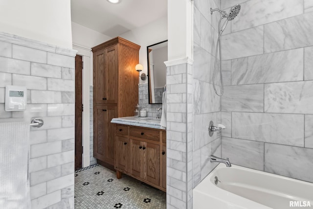 full bathroom featuring  shower combination, tile patterned floors, and vanity