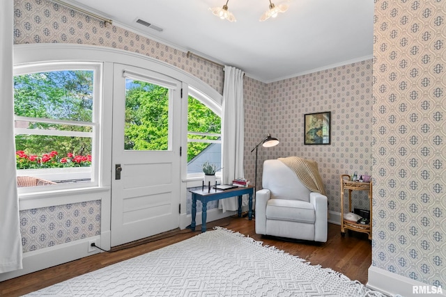 sitting room with wallpapered walls and visible vents