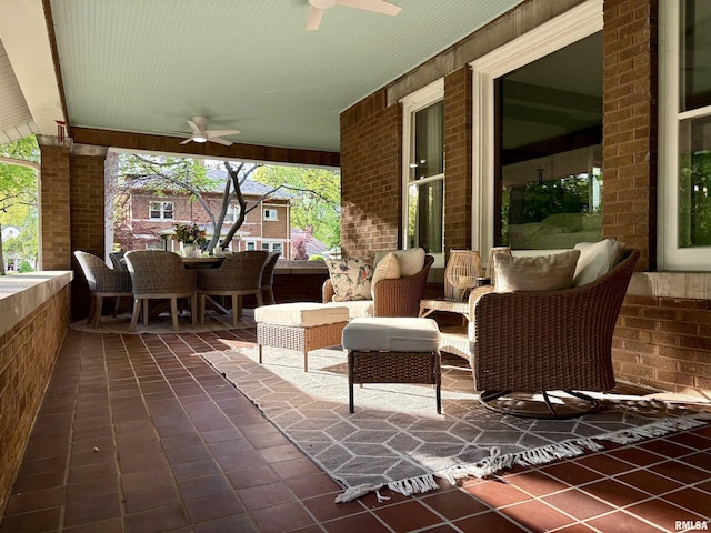 view of patio with outdoor dining area and ceiling fan