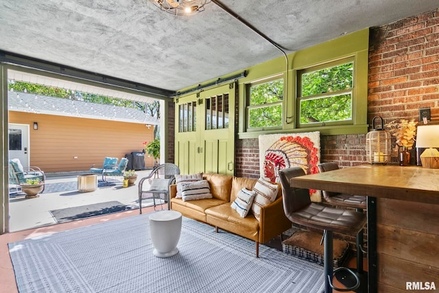 sunroom / solarium featuring outdoor dining area