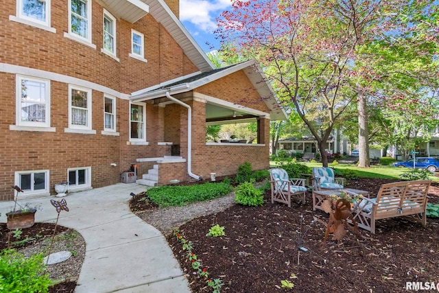 exterior space featuring brick siding