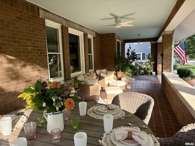 view of patio with ceiling fan and an outdoor living space