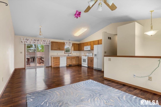 kitchen with lofted ceiling, dark wood-style flooring, white appliances, and a sink
