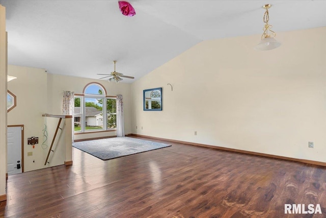 unfurnished living room with lofted ceiling, baseboards, a ceiling fan, and wood finished floors