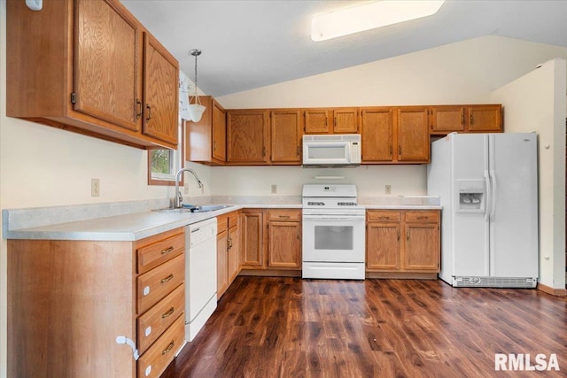 kitchen with a sink, lofted ceiling, white appliances, dark wood-type flooring, and light countertops