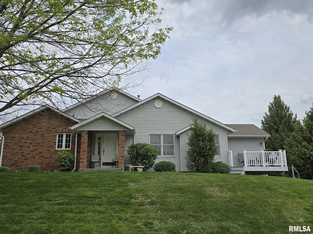 2704 Kings Pointe NE Unit 2704, Quincy, IL 62305 - single story home featuring a front lawn, brick siding, and a deck