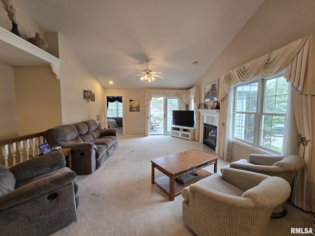 2704 Kings Pointe NE Unit 2704, Quincy, IL 62305 - living area featuring a fireplace with flush hearth, light carpet, ceiling fan, and vaulted ceiling