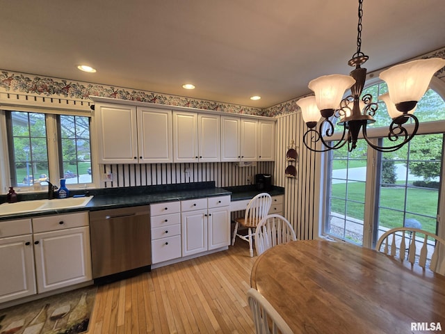 2704 Kings Pointe NE Unit 2704, Quincy, IL 62305 - kitchen featuring a sink, a wealth of natural light, stainless steel dishwasher, light wood-style floors, and a chandelier