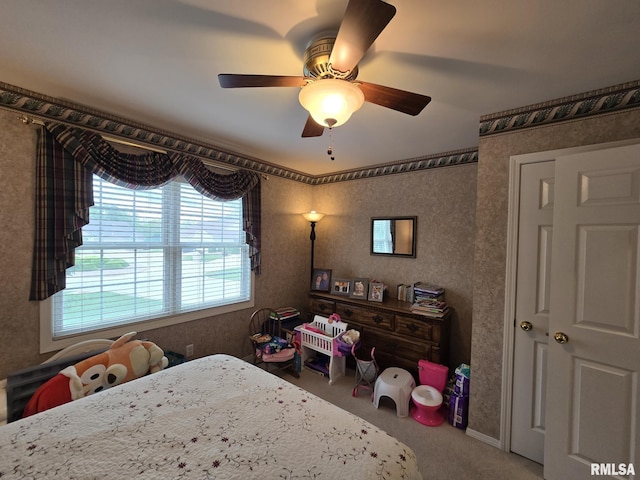 2704 Kings Pointe NE Unit 2704, Quincy, IL 62305 - bedroom featuring a ceiling fan and carpet flooring