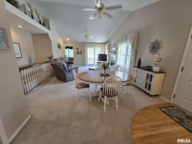 2704 Kings Pointe NE Unit 2704, Quincy, IL 62305 - dining area with a ceiling fan, lofted ceiling, and light colored carpet