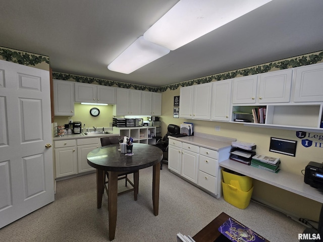 2704 Kings Pointe NE Unit 2704, Quincy, IL 62305 - kitchen featuring white cabinetry, light countertops, and open shelves