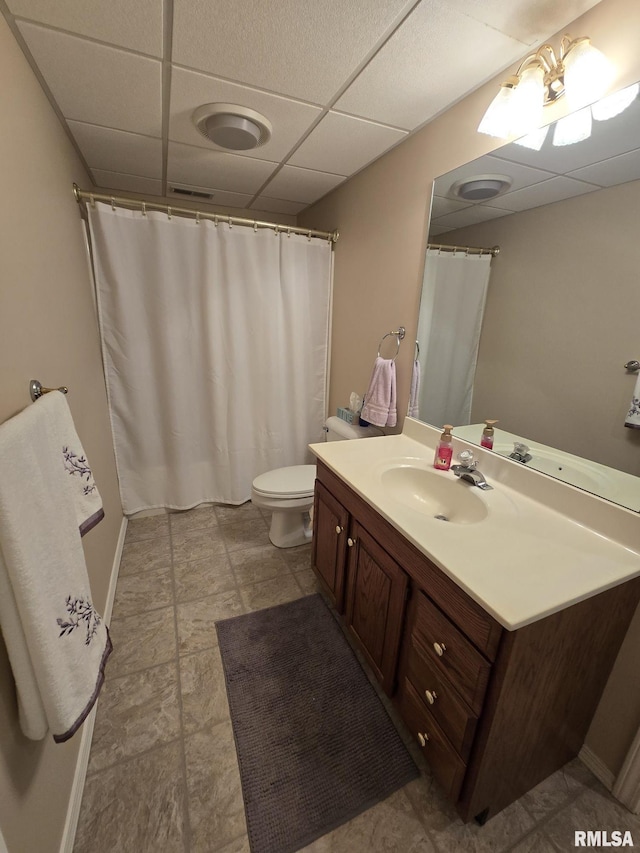 2704 Kings Pointe NE Unit 2704, Quincy, IL 62305 - bathroom with toilet, a drop ceiling, vanity, and visible vents
