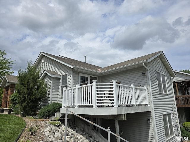 2704 Kings Pointe NE Unit 2704, Quincy, IL 62305 - back of property featuring roof with shingles and a wooden deck