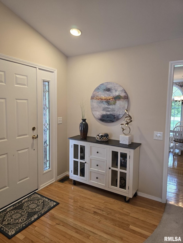 2704 Kings Pointe NE Unit 2704, Quincy, IL 62305 - foyer entrance featuring light wood finished floors, baseboards, and recessed lighting