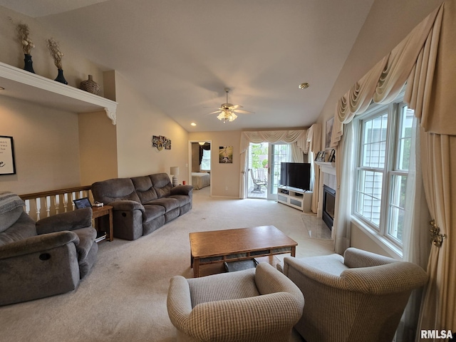 2704 Kings Pointe NE Unit 2704, Quincy, IL 62305 - living area featuring lofted ceiling, light colored carpet, recessed lighting, ceiling fan, and a fireplace with flush hearth