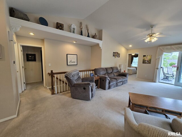 2704 Kings Pointe NE Unit 2704, Quincy, IL 62305 - living room with light carpet, vaulted ceiling, and a ceiling fan