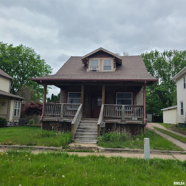 207 W Main St, Knoxville, IL 61448 - view of front of house with a porch, stairway, and central AC unit