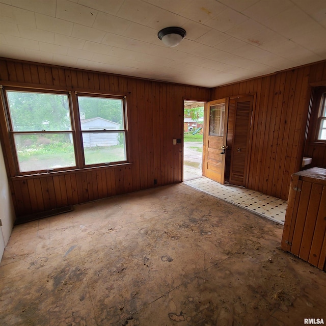 207 W Main St, Knoxville, IL 61448 - spare room with a wealth of natural light and wood walls