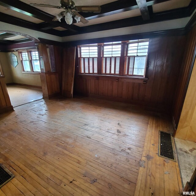 207 W Main St, Knoxville, IL 61448 - empty room with a ceiling fan, arched walkways, light wood-type flooring, and visible vents