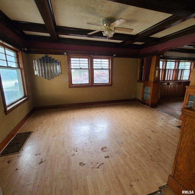 207 W Main St, Knoxville, IL 61448 - unfurnished room featuring coffered ceiling, visible vents, a ceiling fan, and beamed ceiling