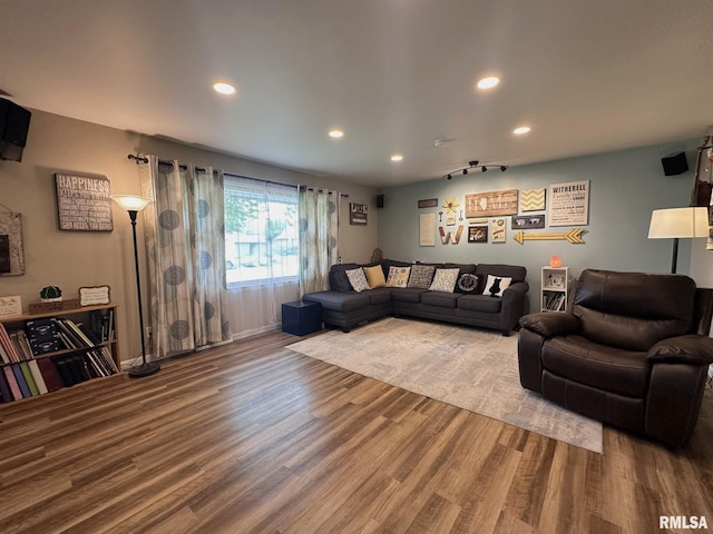 living room with recessed lighting and wood finished floors