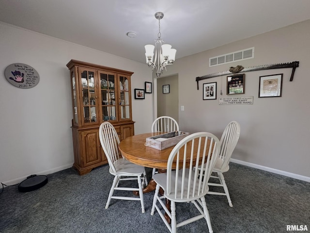 dining room featuring carpet flooring, a notable chandelier, baseboards, and visible vents