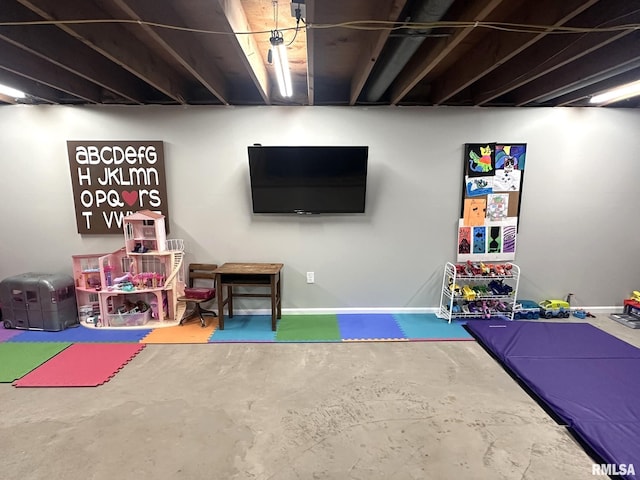 playroom with unfinished concrete floors