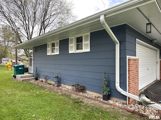 view of side of home featuring a yard