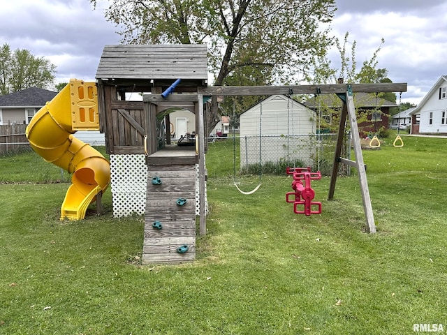 view of playground with a yard and fence
