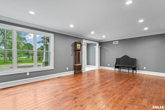 unfurnished living room featuring visible vents, wood finished floors, and recessed lighting