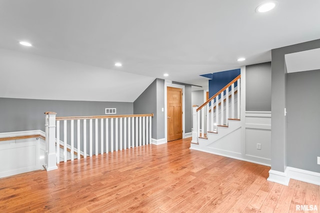 additional living space featuring visible vents, wood finished floors, and recessed lighting