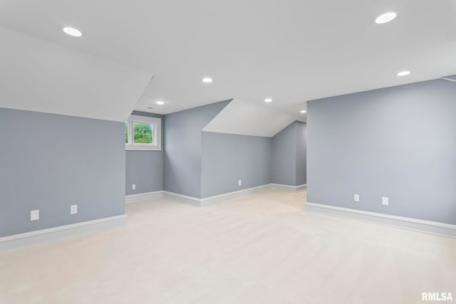 bonus room featuring vaulted ceiling, light carpet, baseboards, and recessed lighting