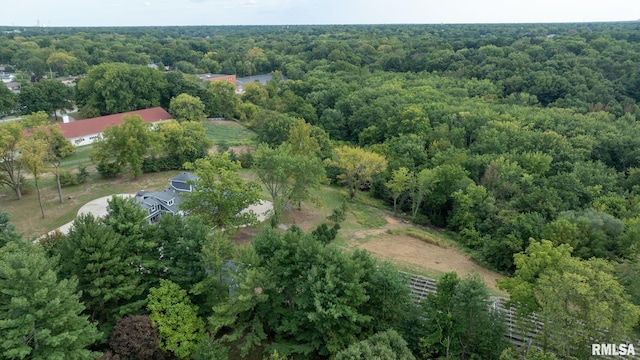 birds eye view of property with a wooded view