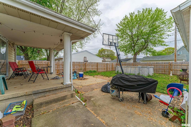 view of patio featuring area for grilling and a fenced backyard